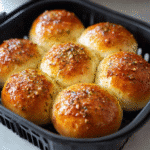 Air frying garlic butter dinner rolls in basket