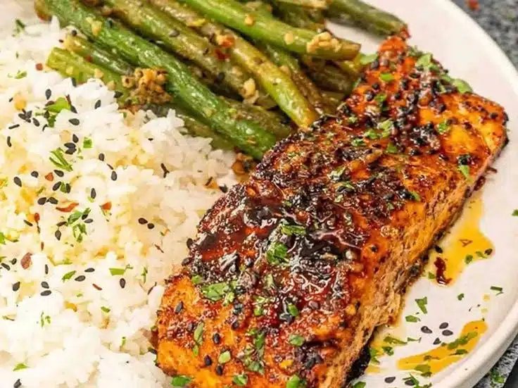 Home 8 Delicious Cajun Honey Butter Salmon served with herbs and spices