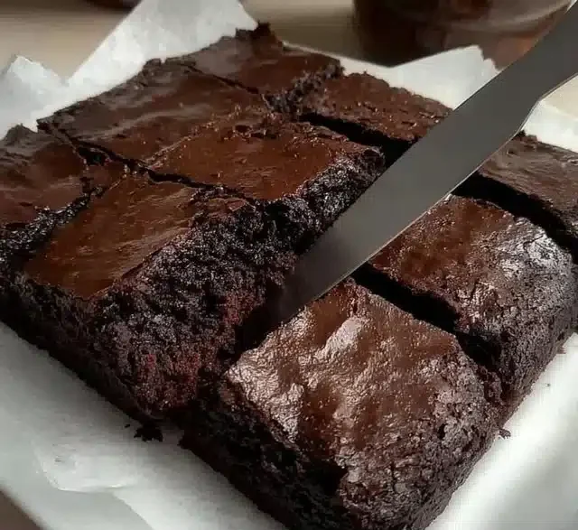 Delicious homemade chocolate cake with rich frosting and decorative toppings.