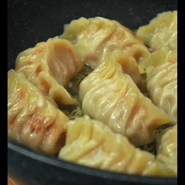 Deliciously crispy and juicy Japanese gyoza served with dipping sauce