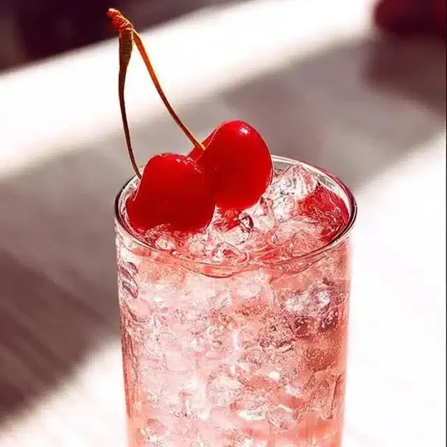 Home 8 Dirty Shirley Cocktail garnished with cherries and served in a glass