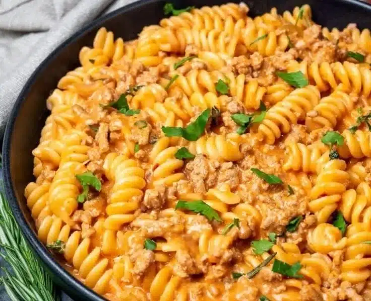 Home 4 Plate of easy ground turkey pasta served with herbs and cheese