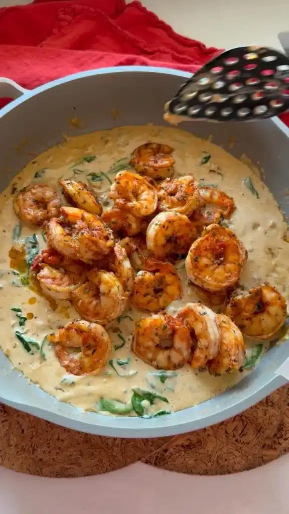 Delicious Easy Marry Me Shrimp dish garnished with herbs and served on a plate.