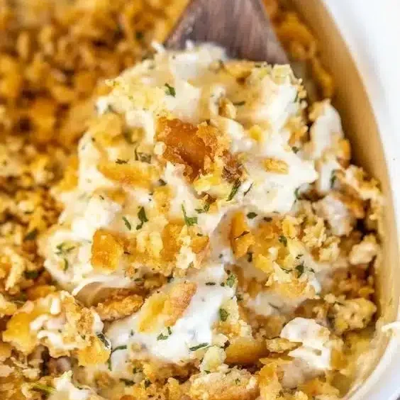 Delicious Million Dollar Chicken Casserole topped with cheesy goodness