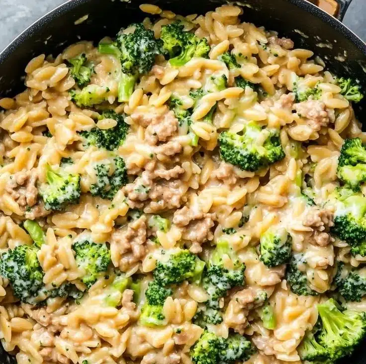 Home 8 One-Pot Ground Turkey Orzo served in a bowl with fresh herbs and vegetables