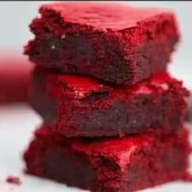 Delicious Red Velvet Brownies with Cream Cheese Frosting on a plate