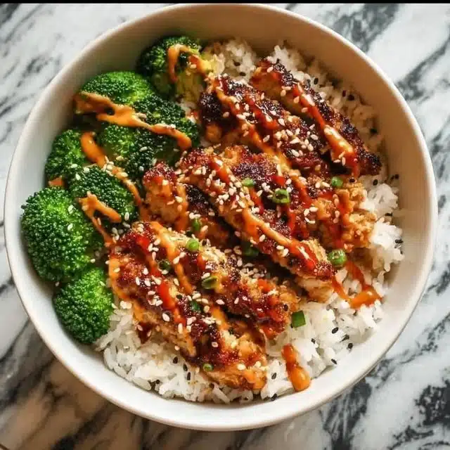 Home 5 Delicious sticky chicken rice bowls ready for a flavorful meal.