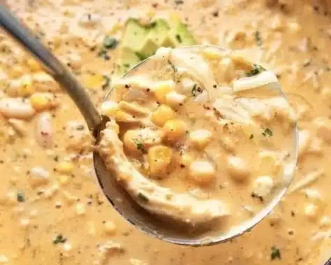 Delicious bowl of white chicken chili topped with cilantro and lime