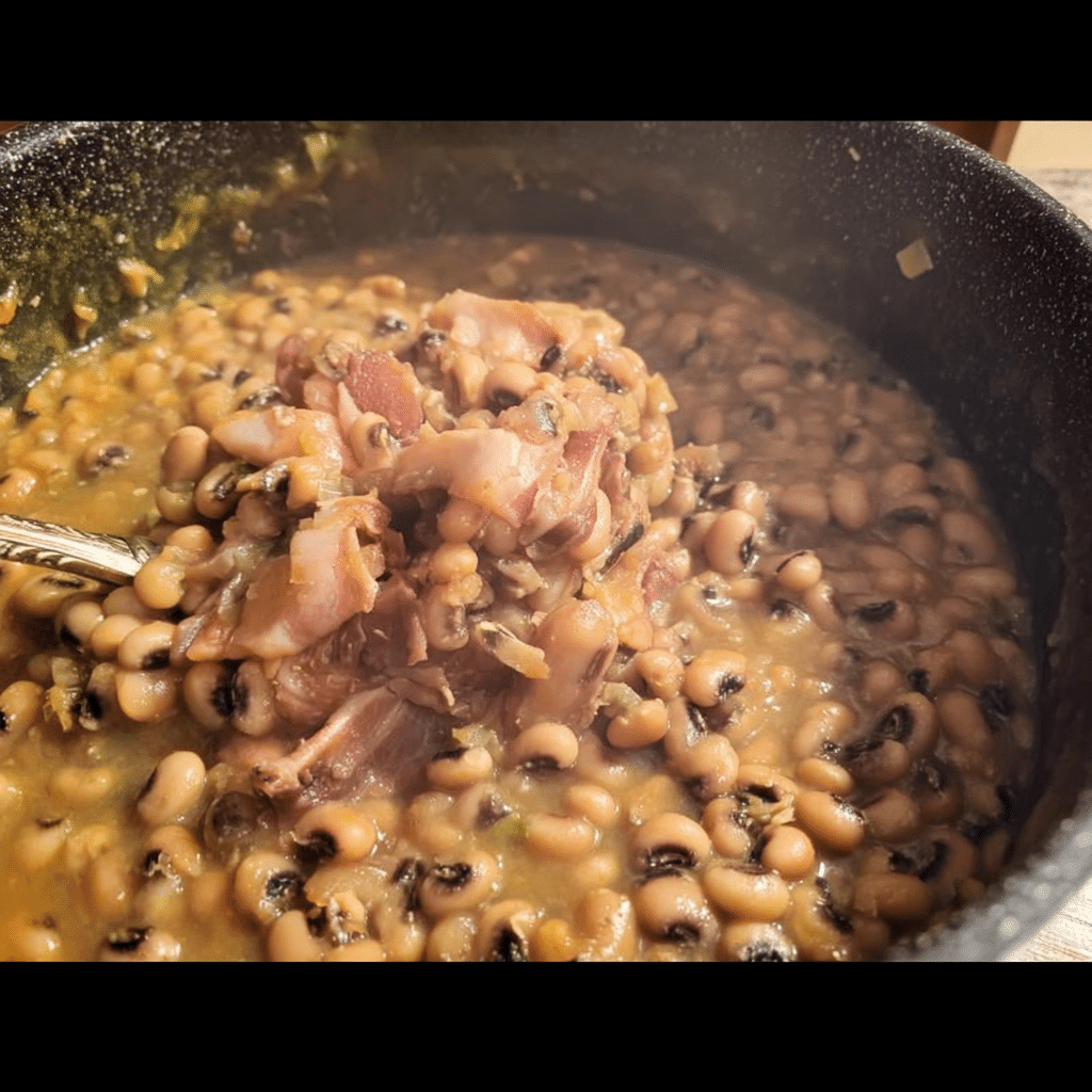 A bowl of delicious black eyed peas recipe served with fresh herbs
