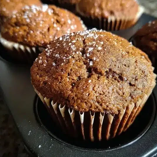 Bakery style gingerbread muffins fresh out of the oven with spices.