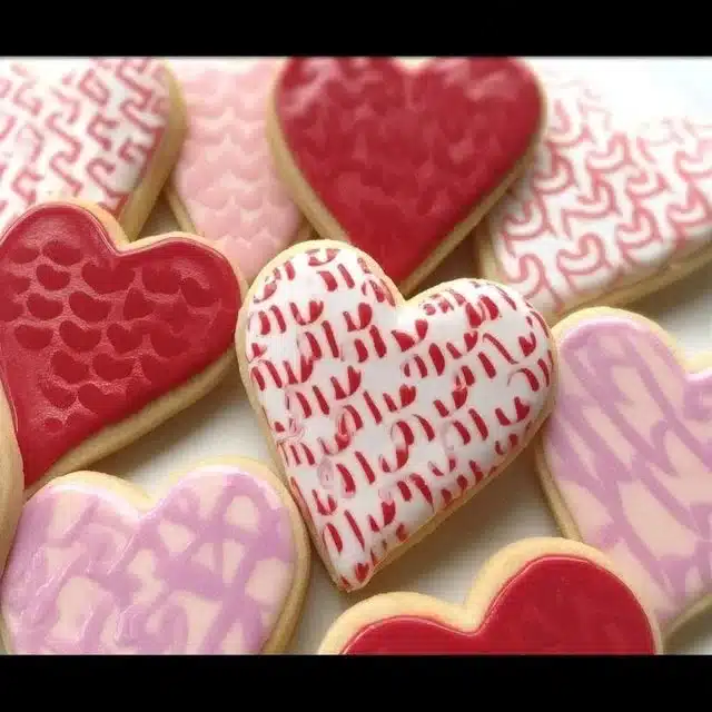 Deliciously decorated Valentine's Day cookies shaped like hearts and flowers.