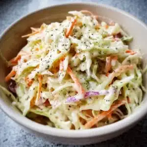 Bowl of creamy coleslaw dressing ready for summer salads